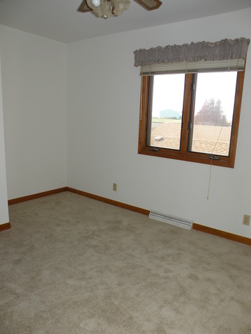 250 Circlegate Road, Unit 250 New Lenox, IL 60451 - Photo 16 of 25 an empty room with a window