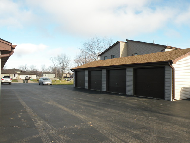 250 Circlegate Road, Unit 250 New Lenox, IL 60451 - Photo 24 of 25 a view of a car park in front of a house