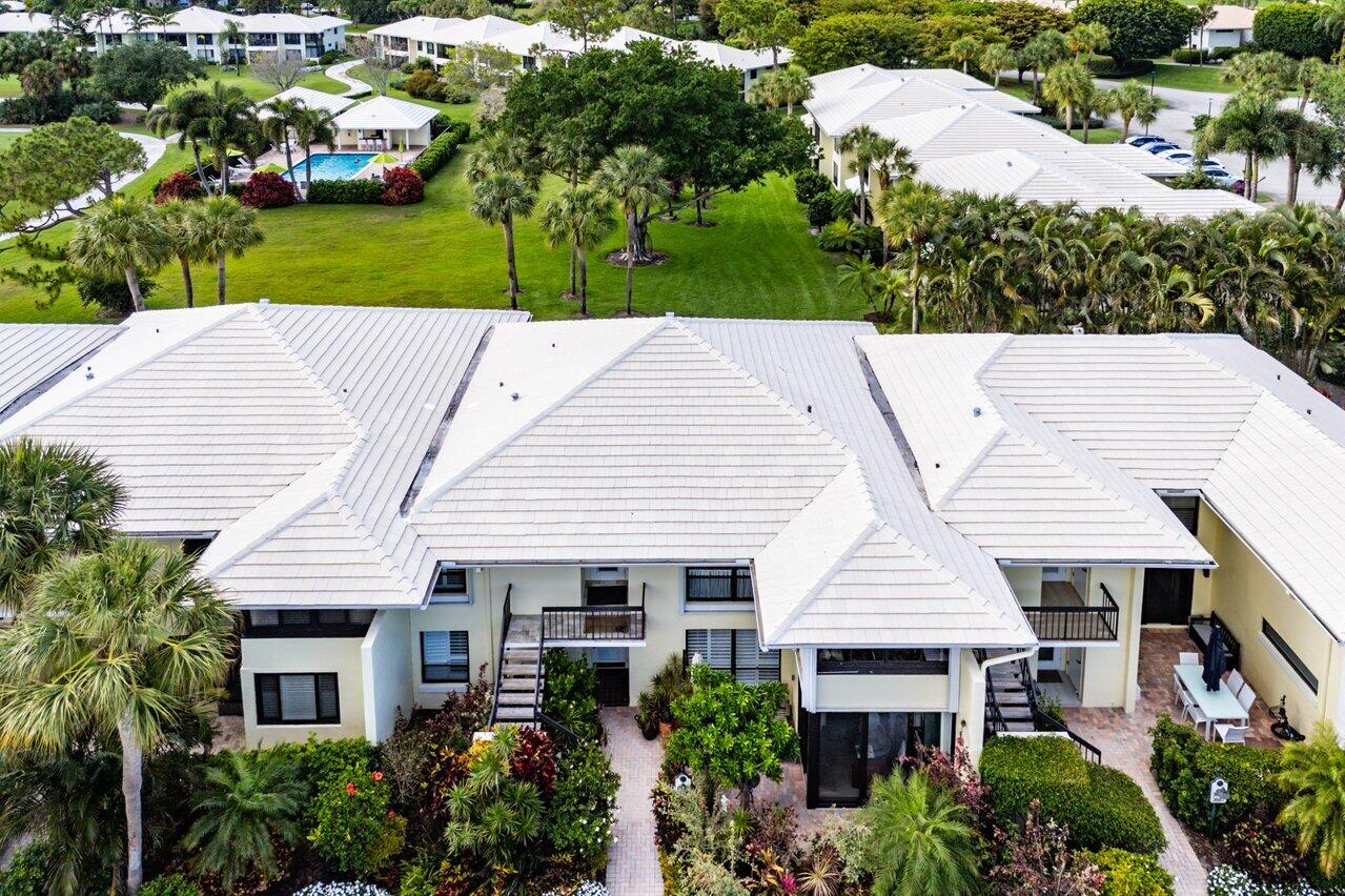 a aerial view of a house with a yard