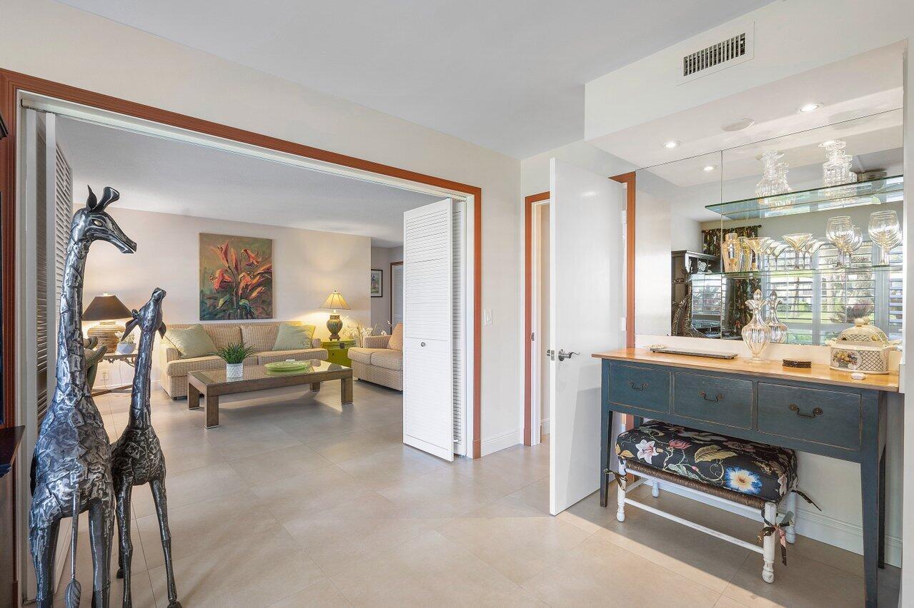 3677 Quail Ridge Drive, Unit BOBWHITE B Boynton Beach, FL 33436 - Photo 13 of 47 a living room with furniture and a window