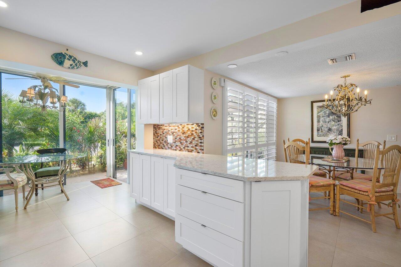 3677 Quail Ridge Drive, Unit BOBWHITE B Boynton Beach, FL 33436 - Photo 14 of 47 a very nice looking living room with a large window