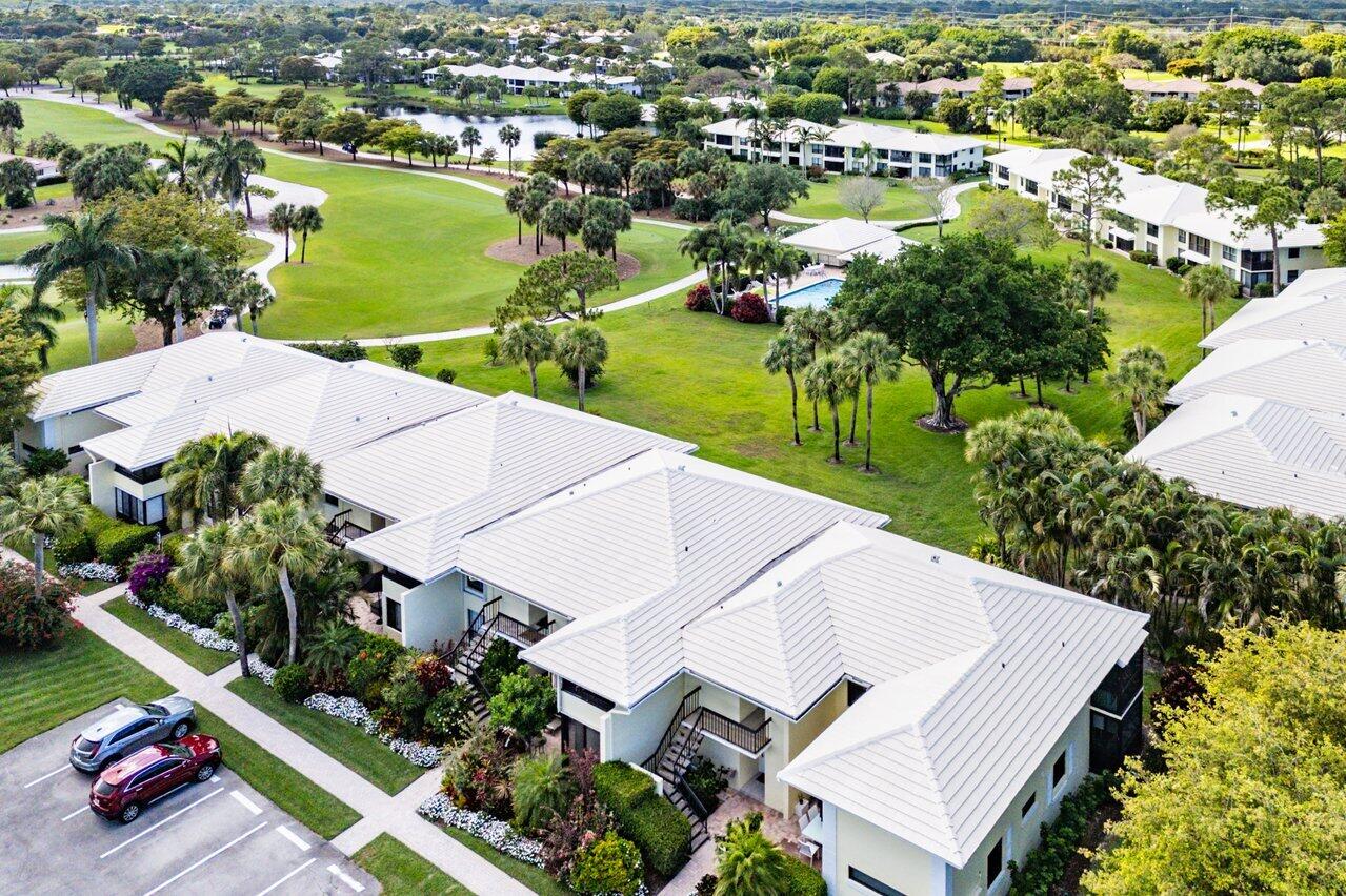 3677 Quail Ridge Drive, Unit BOBWHITE B Boynton Beach, FL 33436 - Photo 28 of 47 an aerial view of a house with a lake view