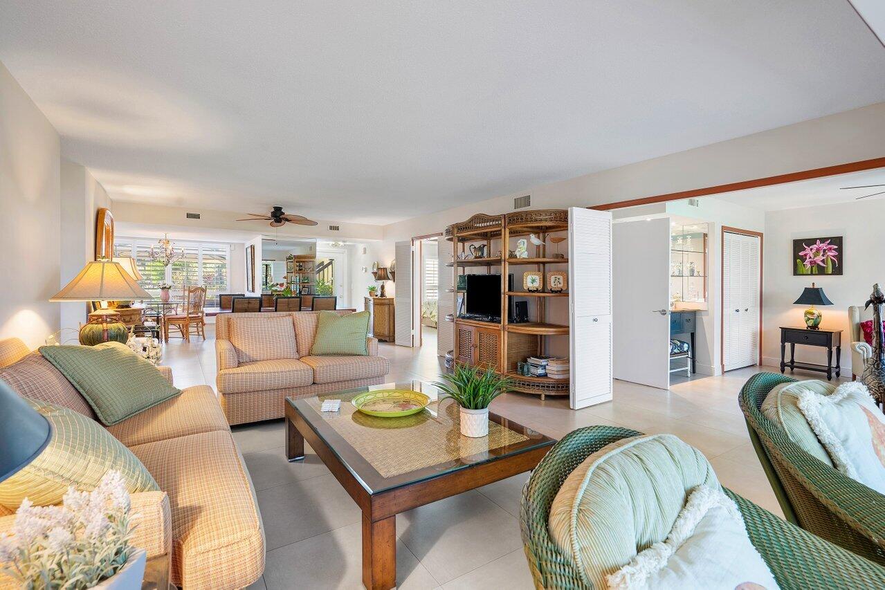 3677 Quail Ridge Drive, Unit BOBWHITE B Boynton Beach, FL 33436 - Photo 9 of 47 a living room with furniture and a table