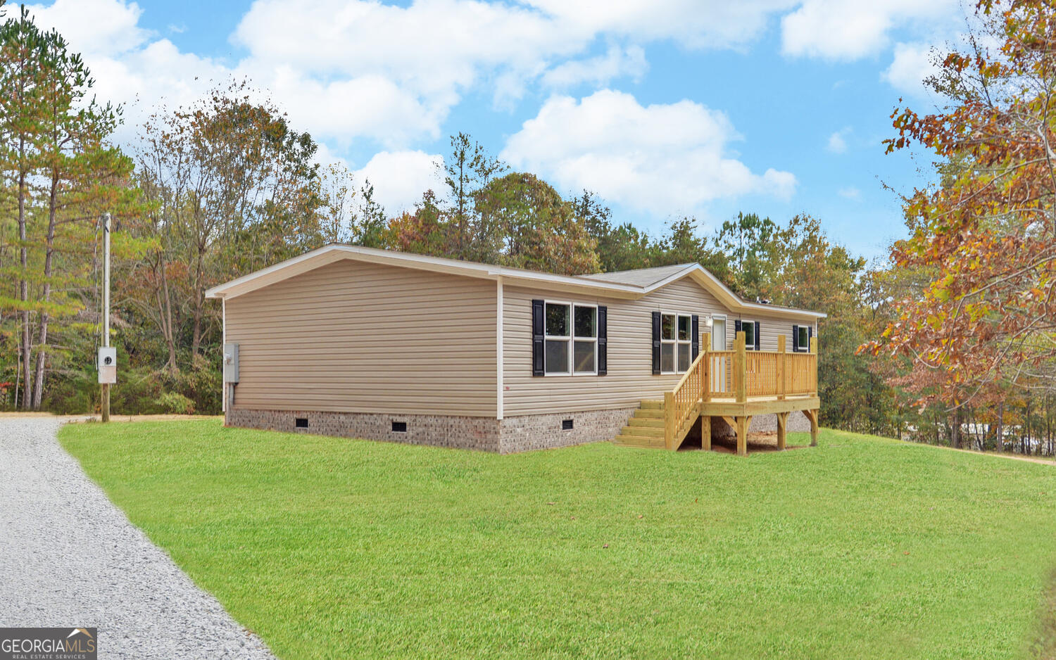 1224 Hunters Creek Road Carnesville, GA 30521 - Photo 1 of 1 a front view of a house with garden