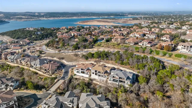 a kitchen with stainless steel appliances a sink stove and cabinets