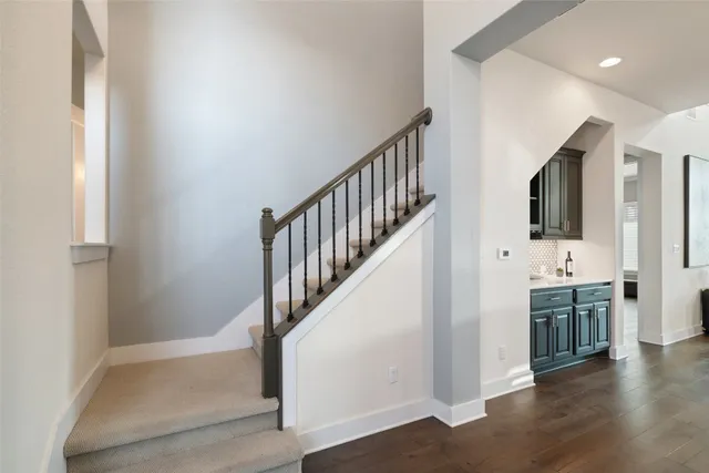 a kitchen with a sink stove and refrigerator