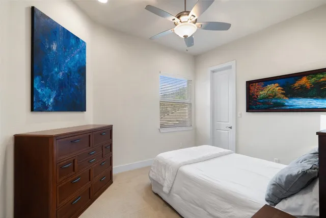 an aerial view of a residential houses with outdoor space and river