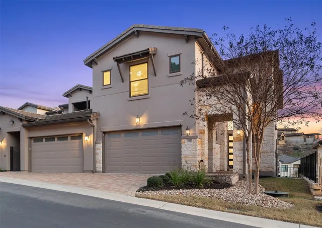 a front view of a house with a garage