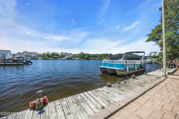 a view of a lake with wooden stairs and a lake view