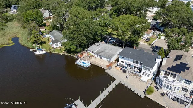 an aerial view of residential house with outdoor space and parking