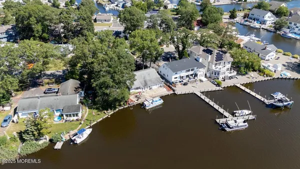 an aerial view of a house with a yard pool outdoor seating and yard