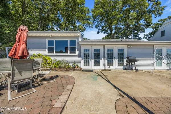 a front view of a house with a yard and fountain
