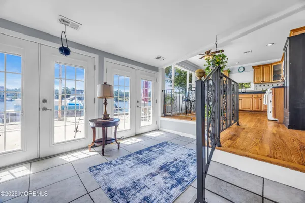 a living room with furniture and a dining table