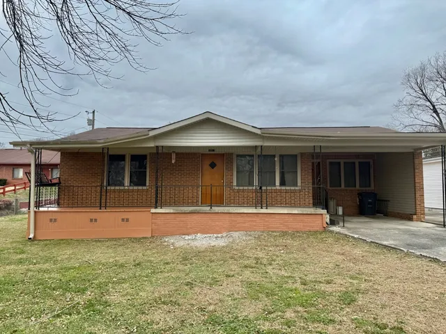 front view of a house with a yard