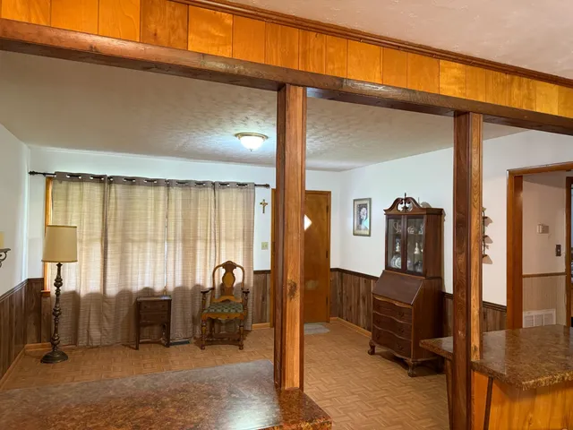 a view of a livingroom with furniture and windows