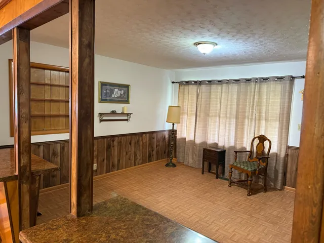 a view of workspace with furniture and window