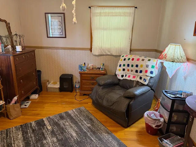 a bedroom with furniture and a bed