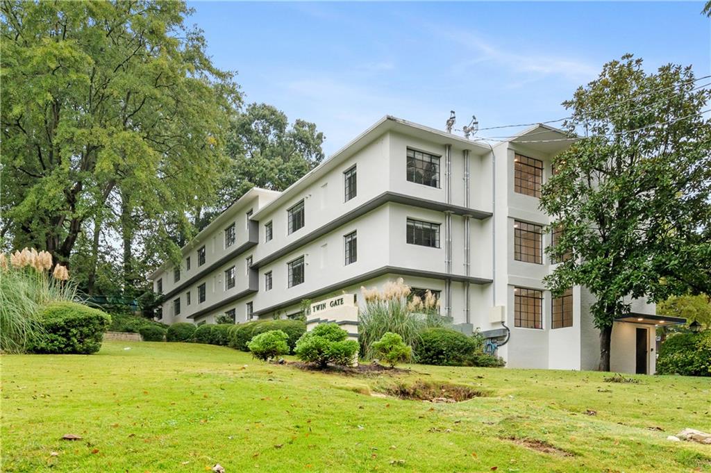 41 25th Street Northwest, Unit 5 Atlanta, GA 30309 - Photo 15 of 15 a view of a building with a yard