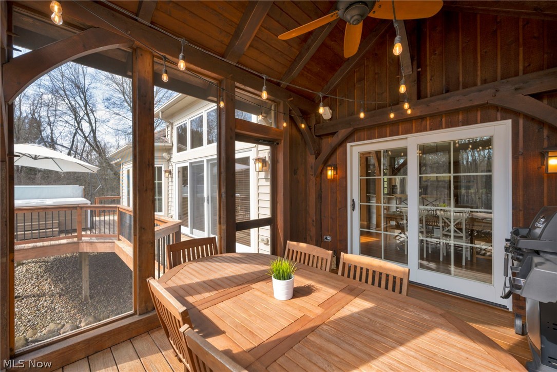 11295 Sutton Place Chardon, OH 44024 - Photo 46 of 50 Sunroom / solarium featuring a high wood beamed ceiling, wood-type flooring, and wooden walls