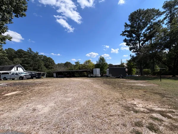a view of outdoor space with deck and yard