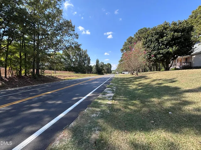 a backyard of a house with large trees