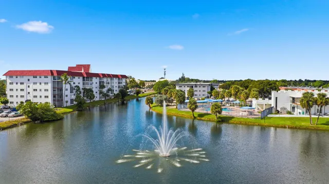 a view of a lake with boats and trees