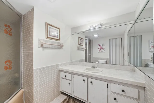 a kitchen with a sink appliances and cabinets