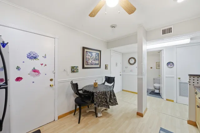 a bathroom with a sink a toilet a mirror and vanity
