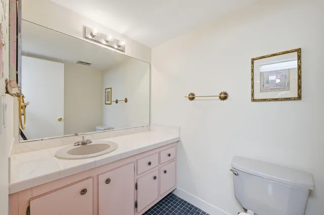 a living room with furniture and flowers