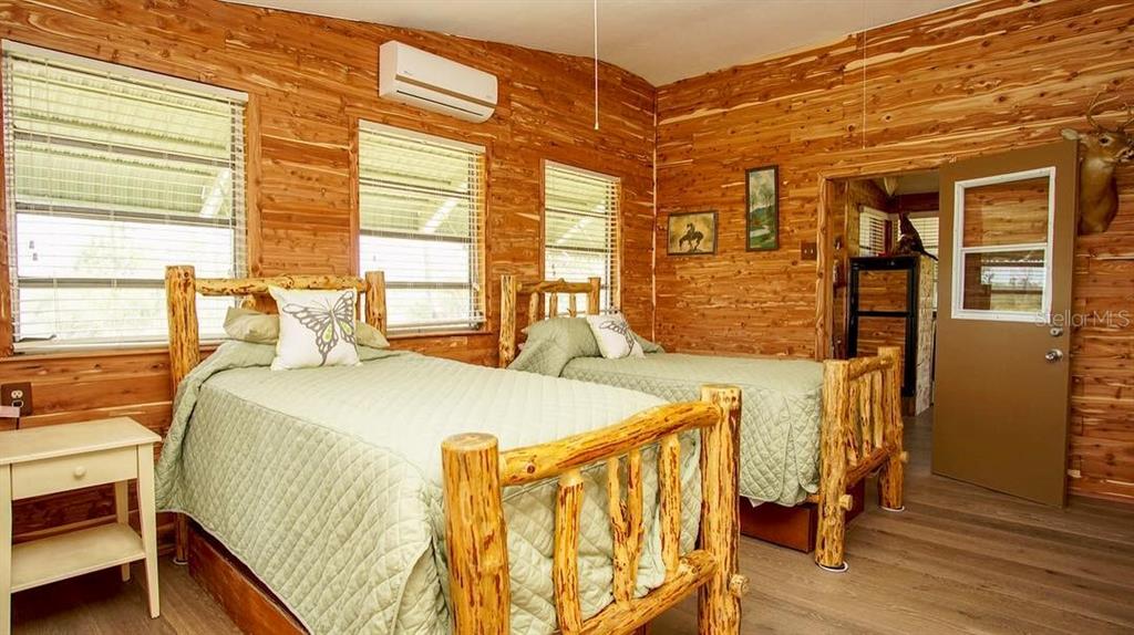 Xx Xx Romor Ranch Ochopee, FL 34141 - Photo 2 of 8 a bed sitting in a bedroom next to a window