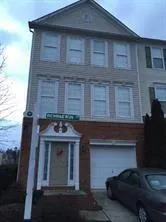 a view of brick house with large windows