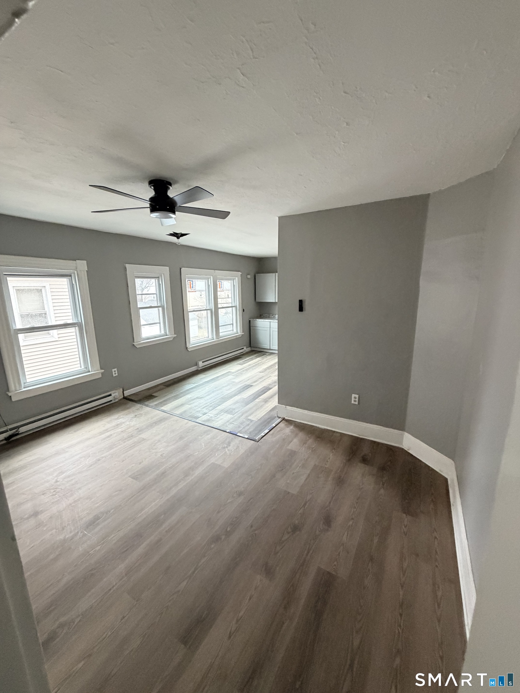 89 Birch Street Manchester, CT 06040 - Photo 11 of 14 wooden floor in an empty room with a window
