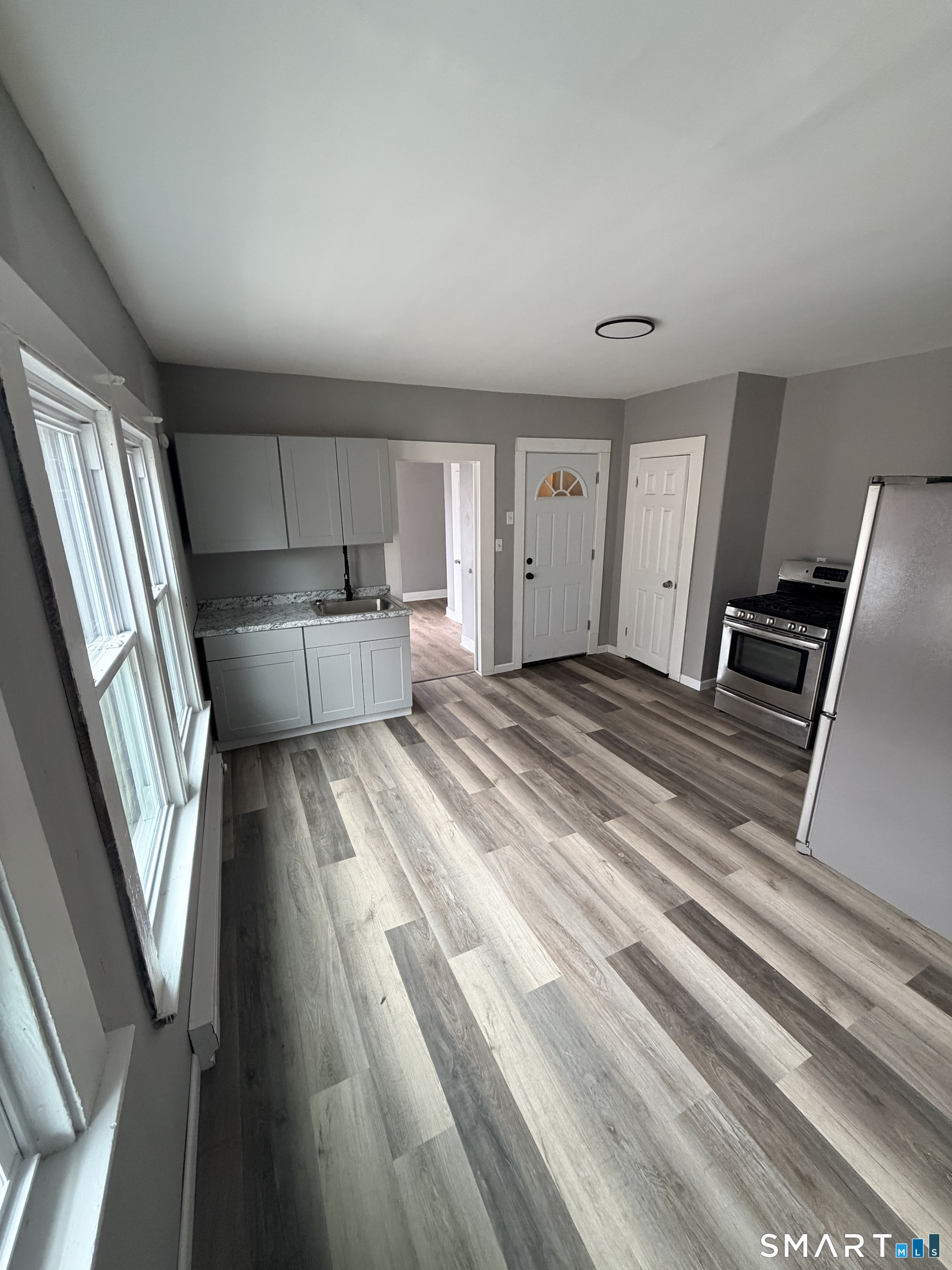 89 Birch Street Manchester, CT 06040 - Photo 14 of 14 a view of a kitchen with refrigerator stove and cabinets