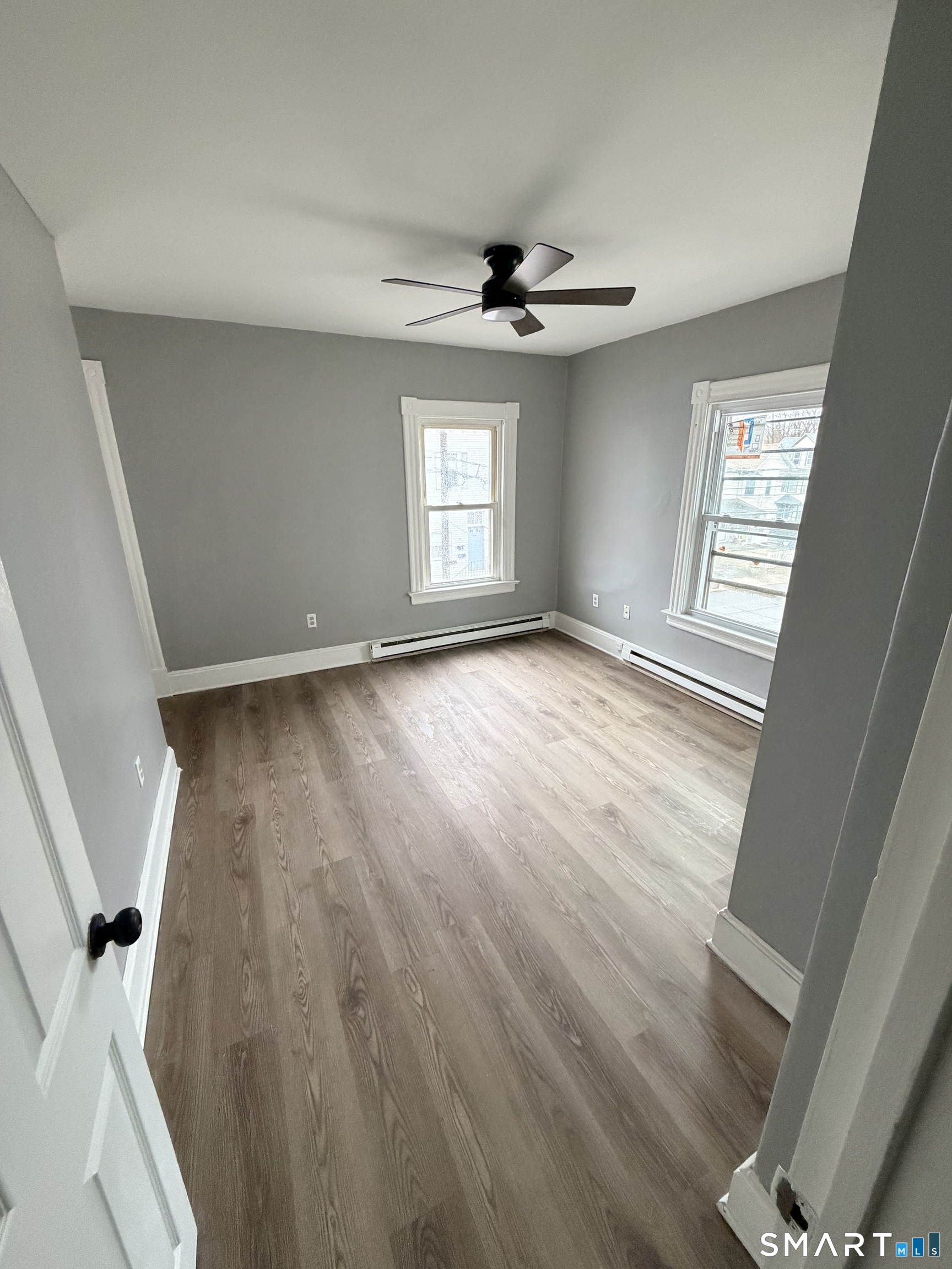 89 Birch Street Manchester, CT 06040 - Photo 6 of 14 wooden floor in an empty room with a window
