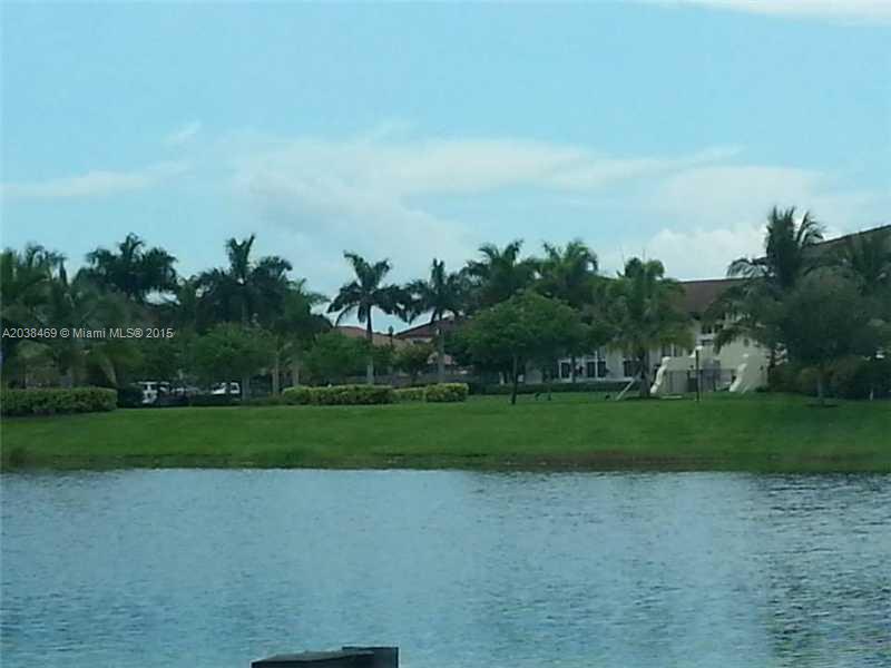 a view of a field and trees