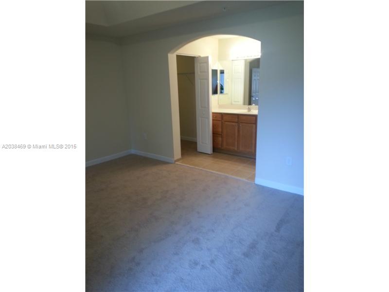 22501 Southwest 88th Place, Unit 1525 Cutler Bay, FL 33190 - Photo 6 of 8 a view of a room with a hallway