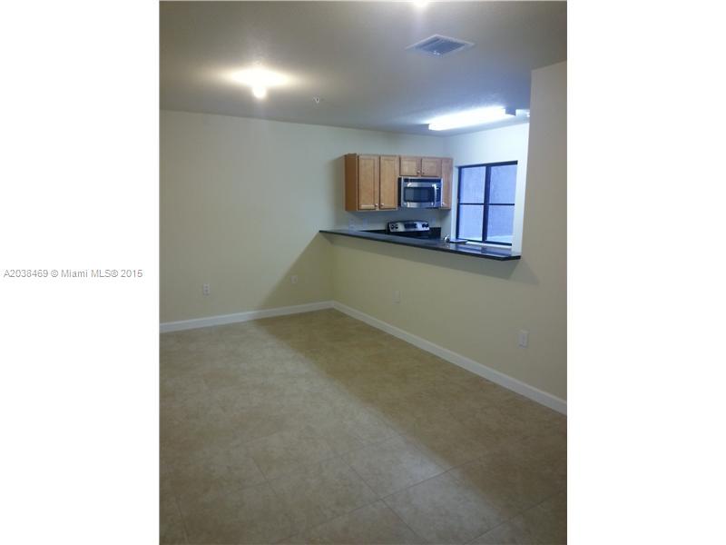 22501 Southwest 88th Place, Unit 1525 Cutler Bay, FL 33190 - Photo 7 of 8 a view of a room with wooden floor