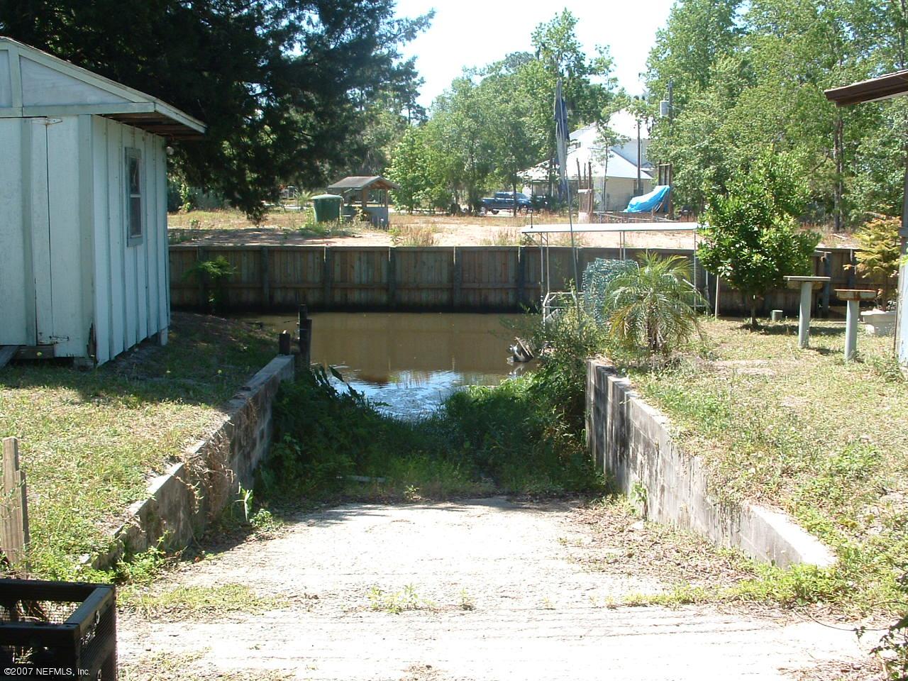 7825 Rusty Anchor Road St. Augustine, FL 32092 - Photo 4 of 5 a view of a backyard
