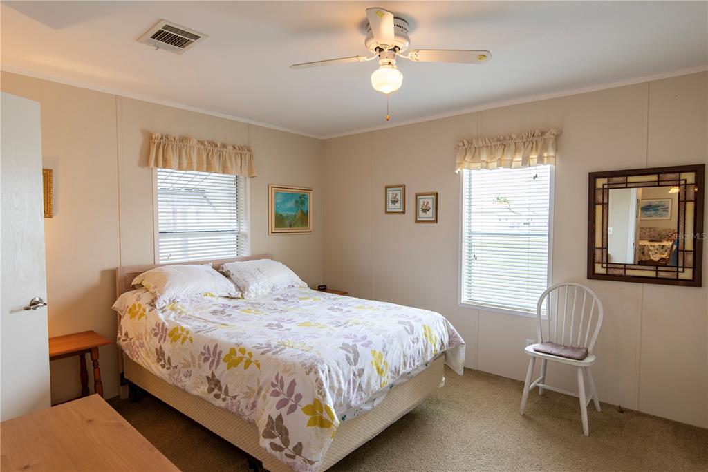 3 Edam Street Punta Gorda, FL 33950 - Photo 7 of 22 a bedroom with a bed a chair and a window