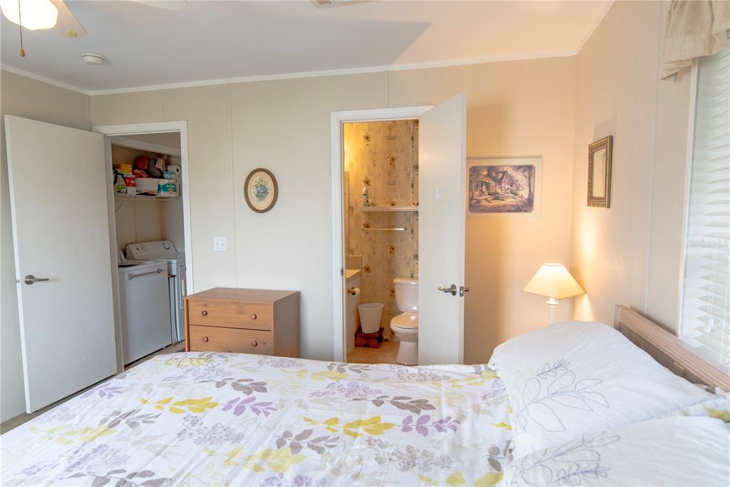 3 Edam Street Punta Gorda, FL 33950 - Photo 8 of 22 a bedroom with a bed and a lamp