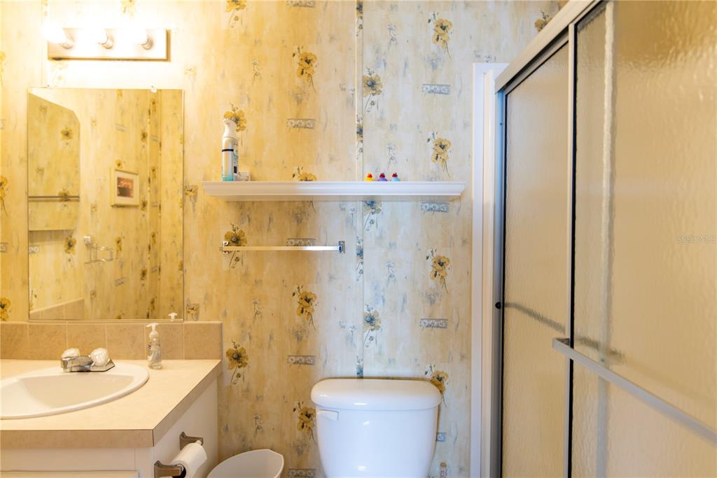 3 Edam Street Punta Gorda, FL 33950 - Photo 9 of 22 a bathroom with a sink a toilet and shower