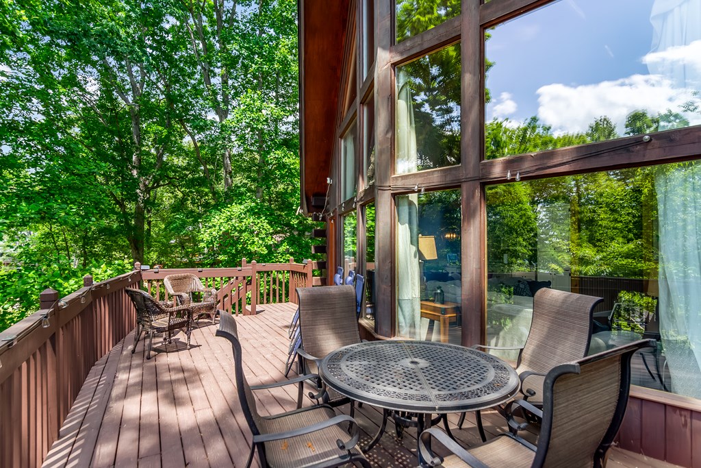 22 Waterloon Trail Morganton, GA 30560 - Photo 34 of 71 a view of a patio with table and chairs and wooden floor