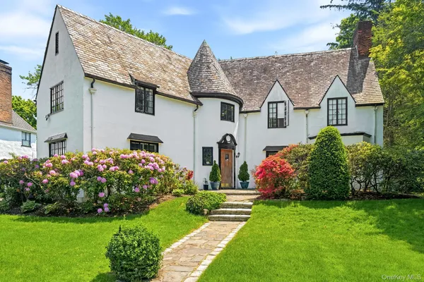 a front view of house with garden