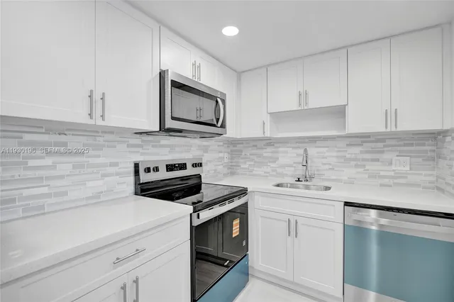 a kitchen with appliances and cabinets