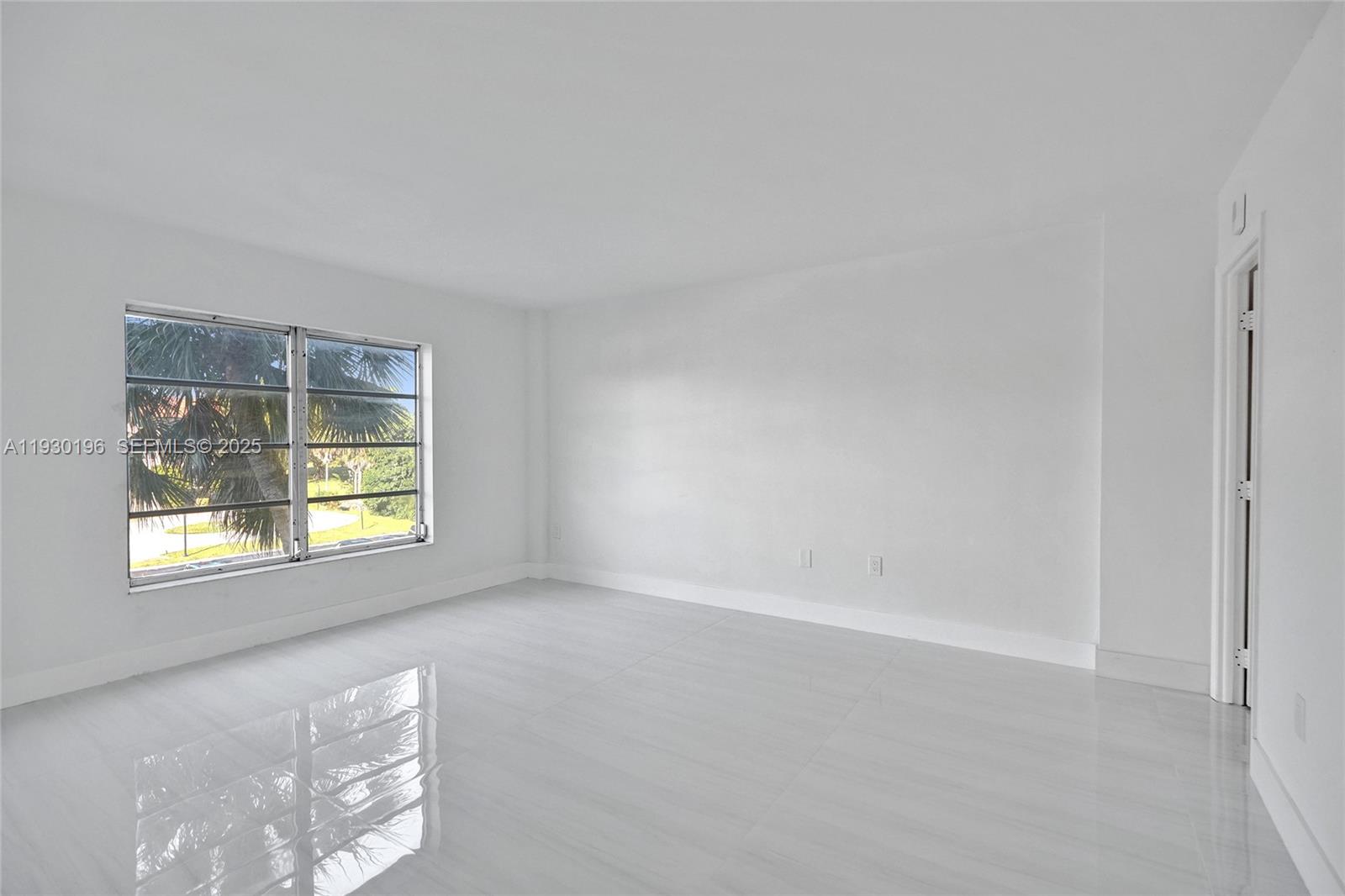 4164 Inverrary Drive, Unit 305 Lauderhill, FL 33319 - Photo 14 of 32 a view of an empty room with a window