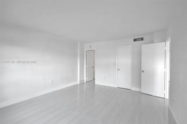 a bathroom with a bathtub shower sink mirror vanity and toilet
