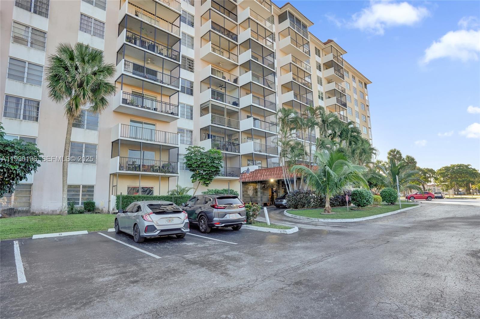 4164 Inverrary Drive, Unit 305 Lauderhill, FL 33319 - Photo 2 of 32 a view of a cars parked in front of a building