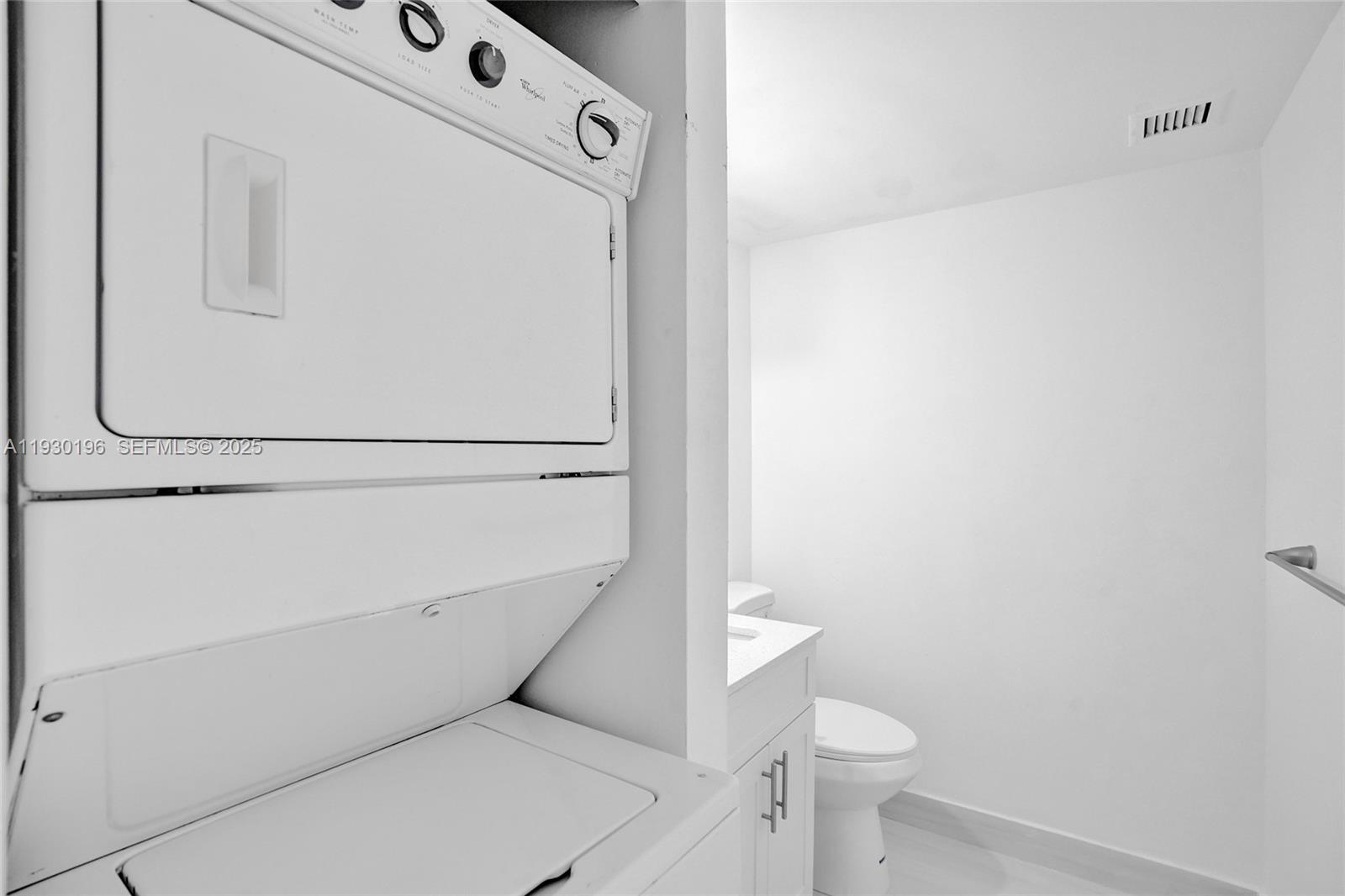 4164 Inverrary Drive, Unit 305 Lauderhill, FL 33319 - Photo 23 of 32 a utility room with dryer and washer