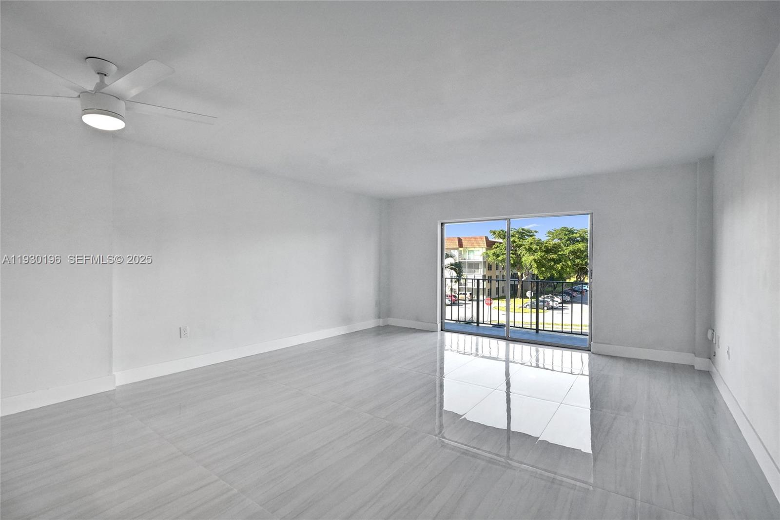 4164 Inverrary Drive, Unit 305 Lauderhill, FL 33319 - Photo 6 of 32 wooden floor in an empty room with a window