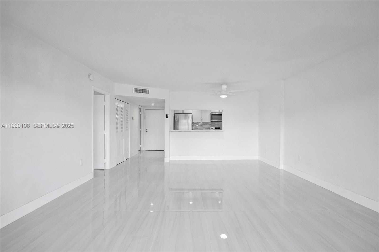 4164 Inverrary Drive, Unit 305 Lauderhill, FL 33319 - Photo 7 of 32 a view of a big room with wooden floor and windows